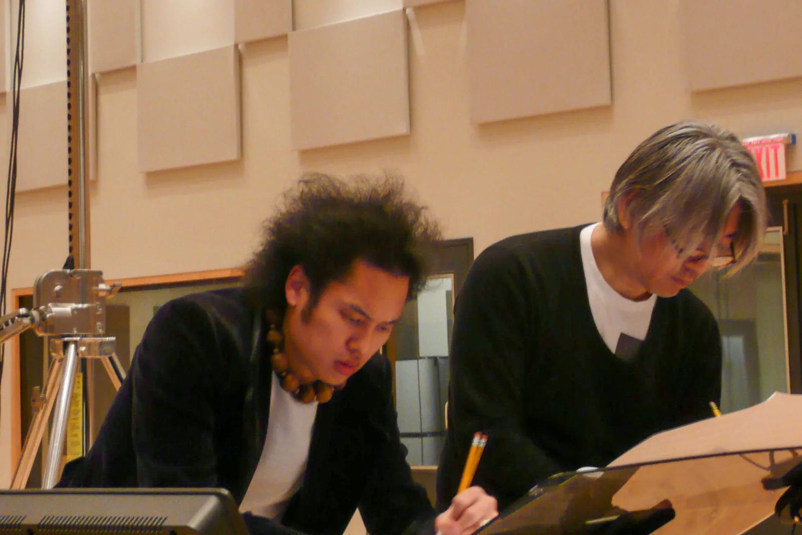 Dana Leong and Ryuichi Sakamoto writing music together at the scoring desk for Women Without Men